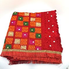 Beautiful Multicolour Phulkari Patterns. This dupatta can be easily paired with any other color dresses for an elegant contrasted look. Phulkari (In Gurmukhi: ਫੁਲਕਾਰੀ) means the floral work. The Phulkari Embroidery is the traditional fabric art of Punjabi. The Phulkari originated in Punjab region and continues to be an integral part of Punjabi weddings to the present day. The women in Punjab wear Phulkari dupattas or phulkari shawls in different occasions like Wedding events, Teeyan Mela etc. wi Multicolor Salwar Kameez For Puja And Navratri, Dupatta With Pallu For Puja During Eid, Multicolor Jamawar Dupatta With Resham Embroidery, Multicolor Resham Embroidered Jamawar Lehenga, Navratri Resham Embroidered Jamawar Dupatta, Navratri Jamawar Dupatta With Resham Embroidery, Red Bohemian Dupatta For Traditional Ceremonies, Traditional Multicolor Zari Work Unstitched Suit, Embroidered Multicolor Jamawar Lehenga