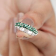 Product Details Enhance your beauty with the fine elegance of this Pave Set Emerald Band Ring. This opulent piece showcases the Emerald Stones set in a half eternity band, creating a captivating and timeless design. Embrace the distinct style this Emerald Ring offers and elevate your look with its exquisite charm. Product Information SKU SHP-RINGS0821193307 Width 1.9 mm Height 3.5 mm Weight 3.28 gm (Approximate) EMERALD INFORMATION No.of Stones 55 Pieces Total Weight 1.07 Carat (Approximate) Dimension(approx) Round-1.50X1.50 mm-36 PcsRound-1.60X1.60 mm-19 Pcs Color Green Cut Brilliant Shape Round Setting Type Pave Setting Quality Grade AAA View More Product Parent Collection Handle wedding-rings Emerald Band Ring, Emerald Band, Enhance Your Beauty, Half Eternity Band, Eternity Band Ring, 18k Yellow Gold Ring, Pave Setting, Emerald Stone, Eternity Band