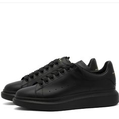 Alexander Mcqueen’s Platform Sneakers Need Little Introduction. Their Stacked Sole And Oversized Silhouette Have Been A Signature Of The Brand For Numerous Seasons Now, A Gift That Keeps On Giving. This Edition Is Stripped Back, Allowing A Calfskin Leather Upper To Provide A Blank Space For Gold Branding, Which You’ll Find At The Heel And Tongue. Calfskin Uppers Leather Lining Rubber Outsole New Without Box Quick Shipping Bundle And Save Black Low-top Platform Sneakers With Branded Heel Counter, Elegant Black Round Toe Sneakers, Classic Black Platform Sneakers With Contrast Sole, Modern Black Platform Sneakers With Studded Outsoles, Classic Black Low-top Platform Sneakers, Black Leather Platform Sneakers, Black Sneakers For Streetwear, Stylish Black Sneakers For Streetwear, Classic Black Lace-up Platform Sneakers