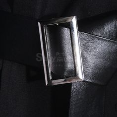 a close up view of a belt with a metal buckle on the front of it