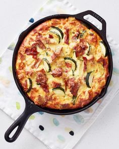 a pizza sitting in a pan on top of a table