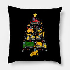 a black pillow with a christmas tree and construction vehicles on it, in front of a white background