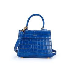 Elizabeth Bag Sapphire Blue Embossed Croc Our signature lady bag is back and now in the uber chic and lux emboss croc calf leather with a suede interior, magnetic snap closure and shoulder strap. This is the perfect bag for any occasion. More Details Width: 7 3/4" Depth: 3 1/4" Height: 6 1/2" Handle Drop: 4" Adjustable shoulder Drop Sapphire Blue, Perfect Bag, Baroque Pearls, Emboss, And Now, Bracelets For Men, Anklets, Blue Sapphire, Calf Leather