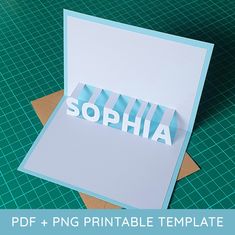 a card with the word sophiia cut out of paper on top of it