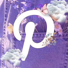 the letter q is made up of flowers and butterflies in front of a purple background