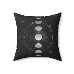 a black and white pillow with circles on it