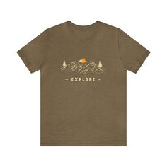 Embark on a cozy adventure with our Explore graphic tee! Wrap yourself in style as you conquer both comfort and the great outdoors. Featuring a stunning mountain panorama that ignites your wanderlust, this shirt whispers the call of exploration. Let your clothing be a testament to your love for adventure – whether you're climbing peaks or cozying up indoors. Gear up for excitement while staying snug in this mountain-inspired masterpiece. Get ready to explore without boundaries, one step – and on Pre-shrunk Tri-blend T-shirt For Outdoor Activities, Tri-blend Graphic Tee T-shirt For Outdoor, Tri-blend Screen Print Tops For Outdoor Activities, Mountain Panorama, Great Outdoors, Jersey Shorts, The Great Outdoors, Boundaries, Climbing