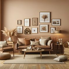 a living room filled with furniture and pictures on the wall