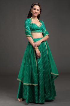 Emerald green and gold brocade silk lined banarasi woven lehenga. Paired with embroidered padded blouse and dupatta.
Components:3
Pattern:Woven and Embroidery
Type of Work:Banarasi weave; Zari, sequins and cut beads embroidery
Neckline:Sweetheart
Sleeve Type:Half sleeves
Fabric:Blouse and Lehenga: Brocade Silk, Dupatta: Silk Organza, Lining: Shantoon
Color:Emerald Green
Other Details:
Temple back
Embroidered waist,neckline and sleeve hems
Zari, cut beads borders and all over sequinned dupatta
No Woven Embroidery, Emerald Green Blouse, Simple Lehenga, Latest Bridal Lehenga, Organza Lehenga, Lehenga Blouse Designs, Lehenga Wedding, Lehenga Collection, Brocade Dresses