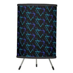 a black and purple lamp shade with blue lines on it