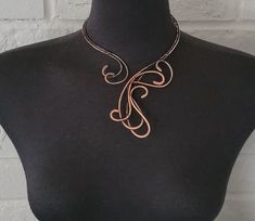 Handcrafted antique copper open necklace with bare copper wire. Hammered, tarnished, polished, and covered with a clear coating to protect the necklace from future discoloration.  If you need to clean your copper jewelry, please clean it by using warm water, and soap. Simply rub the mixture lightly and rinse with clean water and dry with a soft cloth.  Only one available. The pictured jewelry item in this listing is the actual piece you will receive. There are no Photoshop enhancements.  Thank you very much for looking! Happy shopping! Hand Forged Copper Wire Necklace With Adjustable Fit, Adjustable Hand Forged Copper Necklace, Adjustable Bronze Copper Necklace, Adjustable Copper Choker Necklace, Hand Forged Copper Necklace In Rose Gold, Hand Forged Brown Metal Necklace, Hand Forged Rose Gold Copper Necklace, Soldered Copper Rose Gold Necklace, Artisan Bronze Copper Wire Necklace