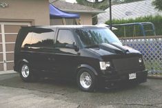 a black van parked in front of a house