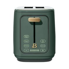 a green toaster sitting on top of a white counter next to a black and gold knob