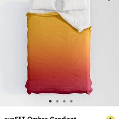 an orange and yellow ombreed comforter on a bed with the words sunset obba gradient above it