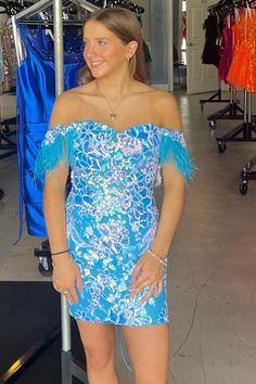 Modsele this blue short dress features off-the-shoulder neckline, feathered straps, lace-up back and bodycon silhouette.#hoco2023#homecomingdresses#formaldresses#homecoming#schooleventdress#holidaydress#graduationdress#cocktaildress Feather Detailed Mini Dress For Prom Season, Feathered Mini Dress For Prom Season, Mini Dress With Feather Trim For Homecoming, Feathered Dresses For Homecoming, Fitted Feather Dresses For Homecoming, Fitted Feather Mini Dress For Prom, Blue Fitted Dress With Feather Trim, Fitted Blue Dress With Feather Trim, Fitted Feather Mini Dress For Prom Season