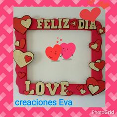 a picture frame with two hearts and the words feliz dia love