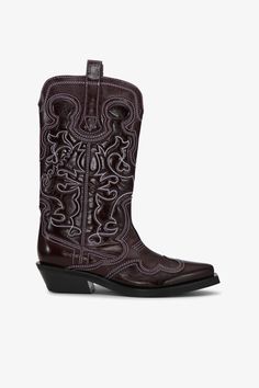 These Burgundy Mid Shaft Embroidered Western Boots feature a pointed toe and embroidered detailing. The shoes have a low, angled heel and pull tabs. GANNI Burgundy Mid Shaft Embroidered Western Boots | Women's Size 10 Ganni Cowboy Boots Outfit, Maroon Cowgirl Boots, Ganni Boots, Western Burgundy Leather Boots, Ganni Western Boots, Black Chunky Boots Ganni, Diy Face Mask, New Arrival Dress, Western Boots