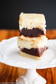 three pieces of cake sitting on top of a white plate