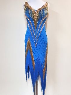 a blue and gold flap dress on display