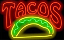 a neon sign that says tacos on it's front and back with the word,