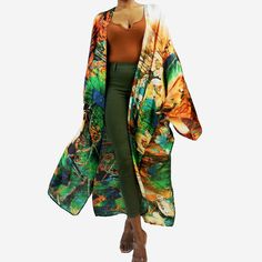 A light-weight long kimono with a luxurious, flowing drape French seam finish Side slits at hem Charmeuse satin, 22mm. Machine wash cold, gentle cycle, hang dry. The Jungle motif of this kimono offset by contrasting shades of sunset orange makes for an alluring combination.  Whether worn over a a tee and jeans, a matchy-matching co-ord set, or as a flowing swimsuit cover, this kimono is sure to turn heads and turn any regular outfit into a stunning showstopper! Kimono Size Measurements: * Should Luxury Orange Floor-length Sets, Luxury Green Floor-length Sets, Luxury Open Front Cardigan For Loungewear, Motif Jungle, Sunset Orange, Long Kimono, Silk Jacket, French Seam, Womens Robes