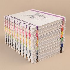 a stack of colored pencils sitting on top of each other