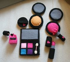 various makeup items are laid out on the floor