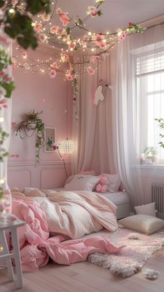 a bedroom decorated in pink and white with flowers on the ceiling, lights strung over the bed