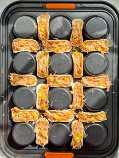 there are many sandwiches that have been placed in the pans on the stove top