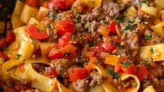 pasta with ground beef and tomatoes in a skillet