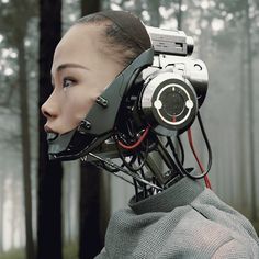 a woman with an electronic headpiece in the middle of her face and trees in the background