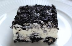 a close up of a piece of cake on a plate with the words oreo dessert above it