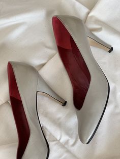 80's Yves Saint Laurent leather pumps. Color is between a very light grey and taupe. Red leather lining inside. 3.5" inch heel height. Size 8 Narrow. Made in Italy. Very good vintage condition. A little fraying around edges. Minor glue stains and a scuff mark on heels. Everything shown in pictures.  Please message for additional photos/info. Ysl Pumps, 5 Inch Heels, Leather Pumps, Womens Heels, Red Leather, Shoes Women Heels, Yves Saint Laurent, Saint Laurent, Heel Height