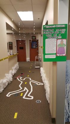 the hallway is decorated with fake snow and paper machs to look like a race track