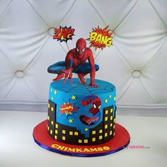 a spiderman themed birthday cake on a table