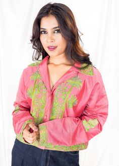 Unleash your desire for adventure with Tropical Blossom! Made from vibrant naturally dyed pink Chanderi natural fabric, this versatile piece features custom hand embroidery in neon green and intricate beading of pearls. Use it as a bold shirt or jacket, and turn any outfit into a statement. Take on the world with this magnificent hand embroidered piece! 🌴 Take on any season with our Tropical Blossom top! 🌴 Made with breathable Chanderi material, it's perfect for both summer and winter. 🌴 The handmade embroidery features intricate beading, adding a touch of uniqueness to your style. 🌴 The model in the picture is wearing a M size for a relaxed and casual look. Heritage Collection, Naturally Dyed, Neon Green, Natural Fabrics, Apparel Accessories, Timeless Elegance, Hand Embroidered, Casual Looks, Hand Embroidery