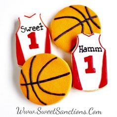 three cookies decorated to look like basketball jerseys