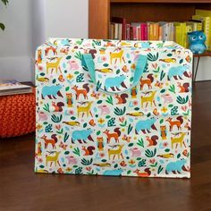 a bag sitting on top of a wooden floor next to a book shelf and bookshelf