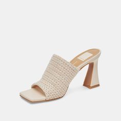 Modern details abound in NOVIS. Her woven mule-style strap, squared toe, and sharp angled heel are guaranteed to turn heads. Style her with a monochrome look in cream or make a statement in blue. Textile Upper Rubber Outsole Synthetic Lining + Sock 3.3" Heel Height Imported Chic Spring Mules With Woven Leather, Chic Woven Leather Mules For Spring, Chic Woven Leather Mules With Open Heel, Elegant Woven Leather Mules For Spring, Elegant Woven Leather Spring Mules, Chic Synthetic Mules With Woven Sole, Formal Spring Mules With Woven Sole, Chic Woven Leather Heels For Spring, Chic Synthetic Mules With Woven Leather