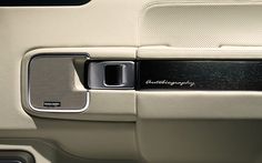 the interior of a car with an automatic door handle