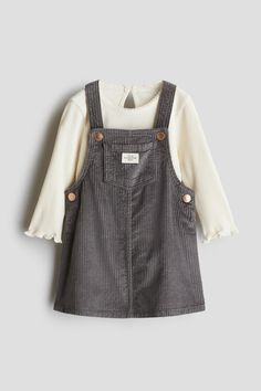 Set in cotton fabric with an overall dress and a ribbed top. Dress in soft corduroy with shoulder straps with snap fasteners  bib pocket  and snap fasteners at sides. Top in jersey with a round  picot-trimmed neckline  keyhole opening at back with a button  long sleeves  and overlocked trim at cuffs and hem. Children Aesthetic, Vintage Kids Fashion, Bear Outfits, Kid Clothes, Snap Fasteners, Girl Clothing, Toddler Clothes, Ribbed Top