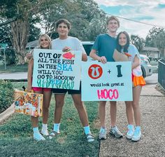 four children holding signs that say out of all the fish in the sea and one would look great at 100