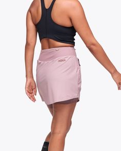 It has pockets. Nine pockets, to be exact. The Mizi Hike Skirt frees you up with stretchy-soft grid jersey for full range of motion, a built-in short liner and so much storage you might be tempted to ditch your pack. Why settle for less, when you can have both performance and style? | Features. Power mesh waistband pockets. Large front zip pockets. Soft, moisture-wicking liner short. Phone-friendly power mesh pockets in liner.. Functional Stretch Skort With Pockets, Functional Stretch Tennis Skirt With Pockets, Functional Tennis Skirt With Pockets For Sports, Functional Stretch Nylon Skort, Functional Tennis Skirt With Pockets, Functional Sports Skort With Side Pockets, Functional Tennis Skirt With Built-in Shorts, Sporty Nylon Skort With Pockets, Sporty Workout Skirt With Pockets