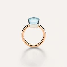 Nudo is quintessentially Pomellato and an iconic design of the house. With the revolutionary idea to free the gem from the bezel and present the naked splendor of the gem, every facet of Nudo’s gemstones evoke Pomellato’s playful spirit and Milanese colorful and understated elegance.As the brand's most iconic ring, Nudo features a sleek, powerful design. Its 'nude' stone is available in infinite mix-and-match combinations of colors and sizes. MATERIAL: 18k Rose and White Gold GEMSTONES: Sky Blue Elegant Blue Topaz Ring With Bezel Setting, Elegant Faceted Blue Topaz Rings, Jewelry By Brand, Gold Skies, Gold Watch Men, Sky Blue Topaz, Fire Heart, Iconic Design, Understated Elegance