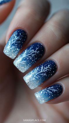 Bring a cool and festive vibe to your holiday style with 21+ blue Christmas nail ideas. From icy blue tones with shimmering silver accents to deep navy designs adorned with snowflakes and stars, these nails are perfect for winter celebrations. Try elegant ombré effects, glittery tips, or frosty patterns to capture the magic of the season. #BlueChristmasNails #HolidayNailInspo #FestiveNailArt2024 Winter Themed Nail Art, Nail Art For New Years, Star Of Bethlehem Nails, Icy Nail Designs, Navy Holiday Nails, Icey Nails Winter, Blue Christmas Nails Winter Snowflake Designs, Frosty Nail Designs, White Nails With Blue Glitter