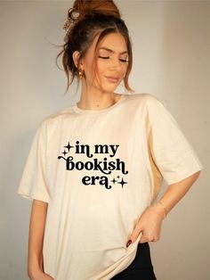 In My Bookish Era Graphic Tee100% combed and ring spun cotton Bella Canvas Brand Literary White Cotton Tops, White Cotton Literary Tops, In My Era, Chic Boutique, Turks And Caicos Islands, Trinidad And Tobago, Bella Canvas, Graphic Tee, Spun Cotton