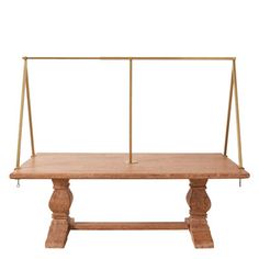 a wooden table with two metal bars on it's legs and a white background