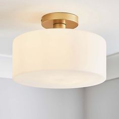 a close up of a light fixture in a room with white walls and flooring