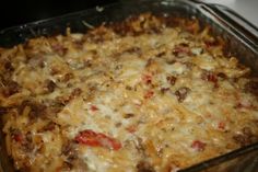 a casserole dish with meat and cheese in it