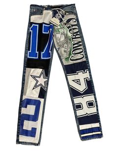 Show your love for the Dallas Cowboys with this vintage jersey patchwork jean. The design makes it perfect for any National Football League (NFL) fan. Get ready to cheer on your favorite team, and stand out from the crowd with this unique Dallas Cowboys jersey pant. The jeans still have the tag from the Cowboys Stadium Pro Shop. They are made with orange tabbed Levi's and have a spot that has been reinforced on the back. They have spots where the jeans need to be Fray Checked or stitches added due to loose thread. Don't miss out on these one of a kind pair of jeans. Shipped priority mail with insurance. Straight Leg Mid Rise Inseam: 33" Front Rise: 10" Waist: 30" around the entire waist Leg Opening: 13.5" around the entire leg opening Jeans Patchwork Fashion, Jersey Patchwork, Cowboys Stadium, Cowboys Jersey, Vintage Dallas Cowboys, Dallas Cowboys Jersey, Cowboy Pants, Patchwork Fashion, Nfl Fan